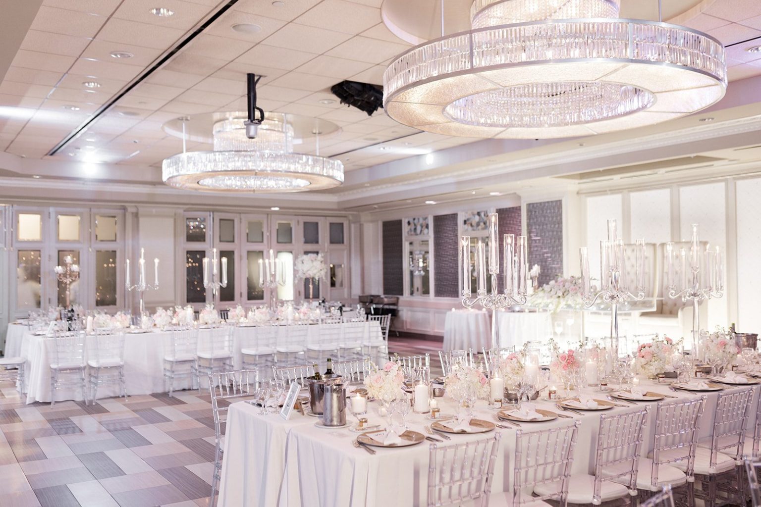 The Paragon set with long banquet tables and tall glass candelabras