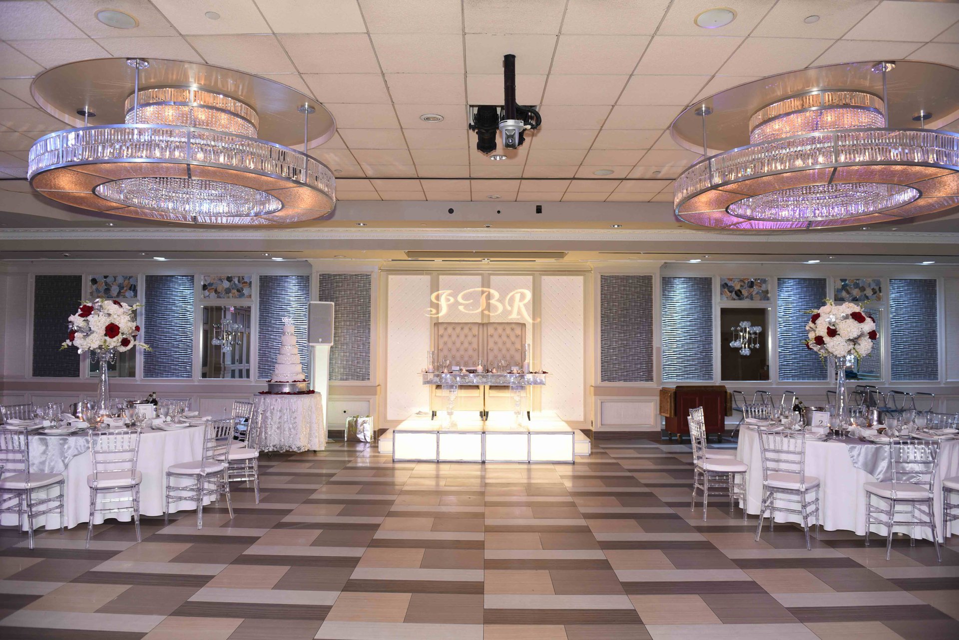 The Paragon set for a reception, with red and white roses on each table