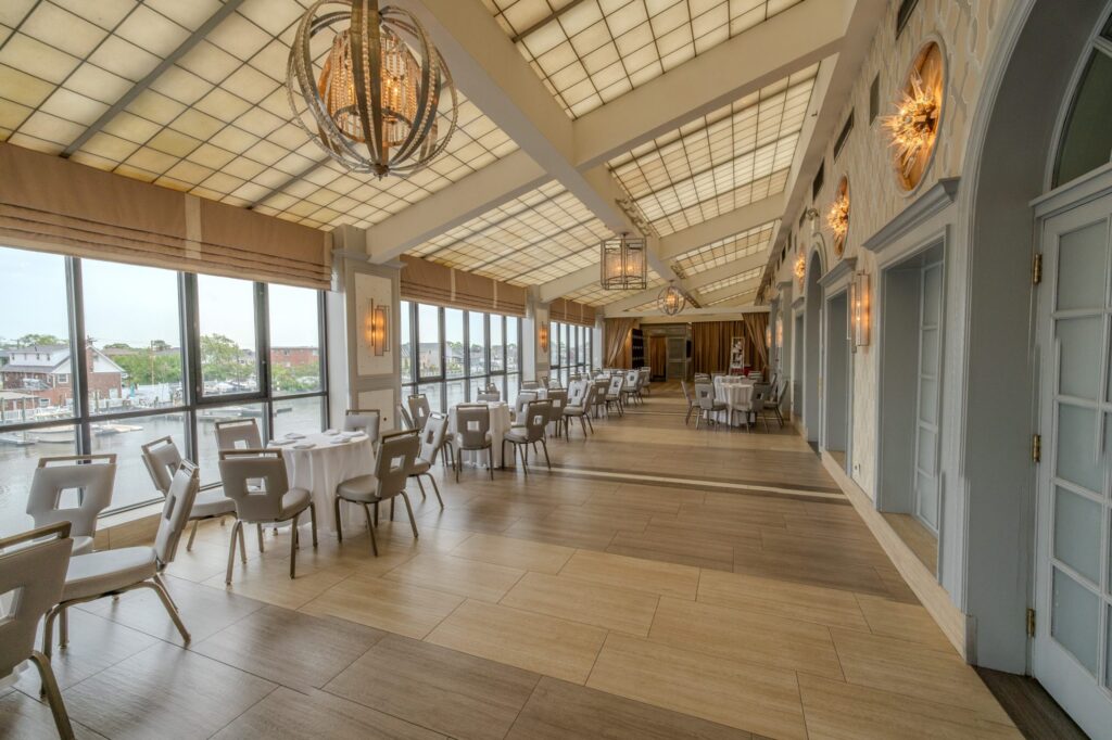 The Promenade, a skylit glass gallery with tables along its waterfront windows
